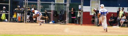 Thirdbaseman Devin scoops up the ball.